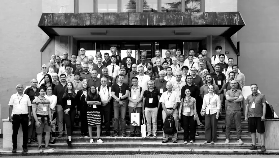 QRS 2024 participants on the steps of the auditorium building